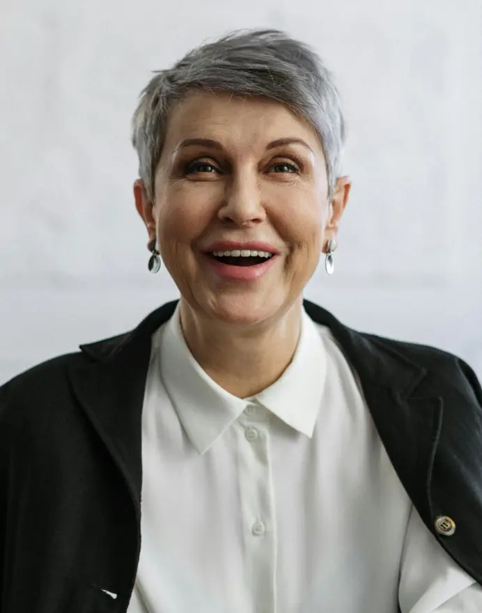 Maria Nieves, an elegant elderly woman smiling