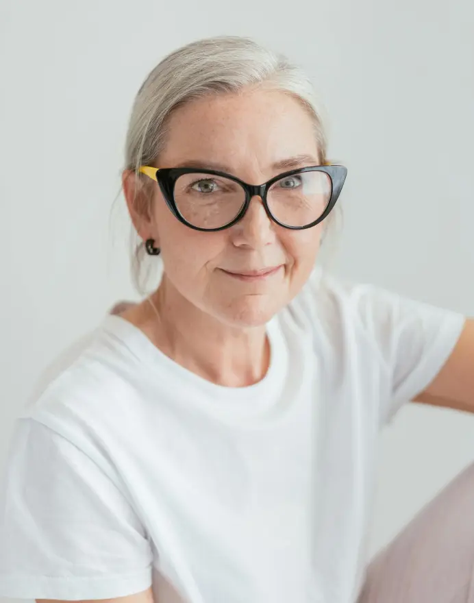 Eva Clark, an elderly woman with glasses